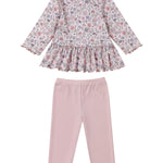 The Mabel and Honey Whimsical Wildflower Two Piece Set features a long sleeve floral peplum top with a charming ruffled hem, beautifully paired with plain light pink leggings for a sweet and stylish girls’ outfit.