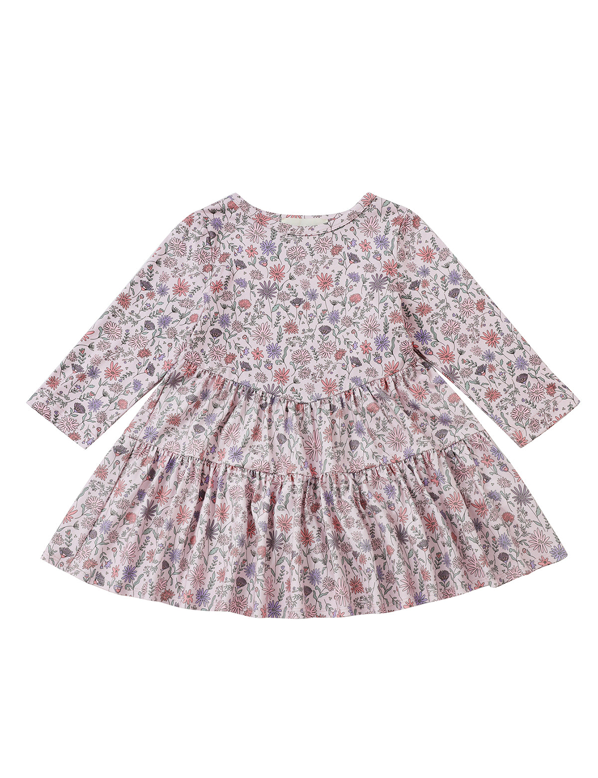 The Mabel and Honey Whimsical Wildflower Dress is a long-sleeve, knee-length A-line dress for children, showcasing a colorful wildflower print on a white background. It features a gathered waist, round neckline, and a charming ruffled tiered skirt.