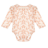 The Mabel and Honey Honey Petals Bodysuit Long Sleeve Floral Print Ruffle Shoulder Bodysuit features a charming peach floral pattern on a white background, with delicate ruffled shoulder details.