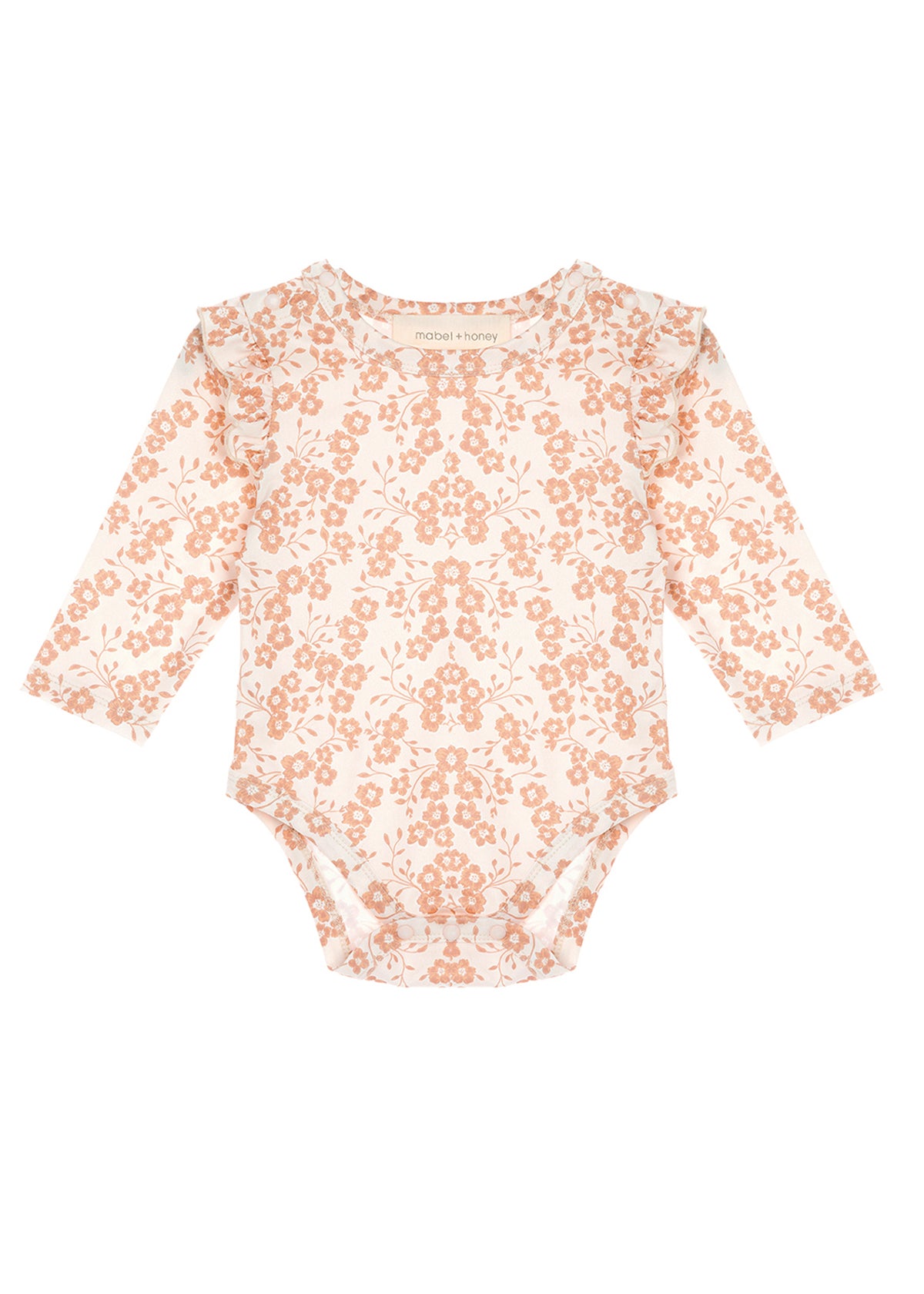 The Mabel and Honey Honey Petals Bodysuit Long Sleeve Floral Print Ruffle Shoulder Bodysuit features a charming peach floral pattern on a white background, with delicate ruffled shoulder details.
