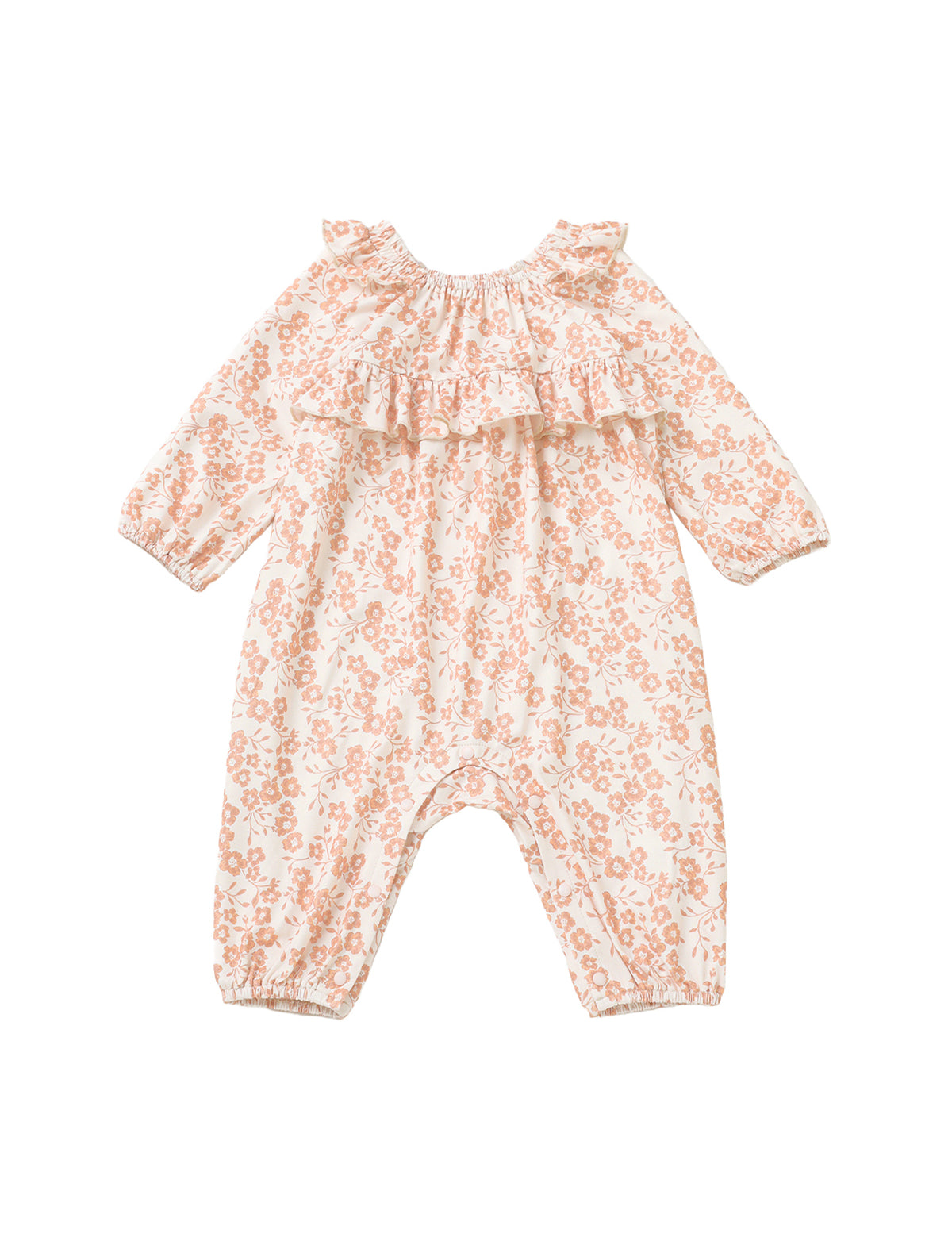 The Mabel and Honey Honey Petals Romper features long sleeves, a ruffled neckline, and a charming pink Honey Petals floral print on a white background. Crafted from soft stretch knit fabric, this straight leg romper is shown laid flat on a white surface.