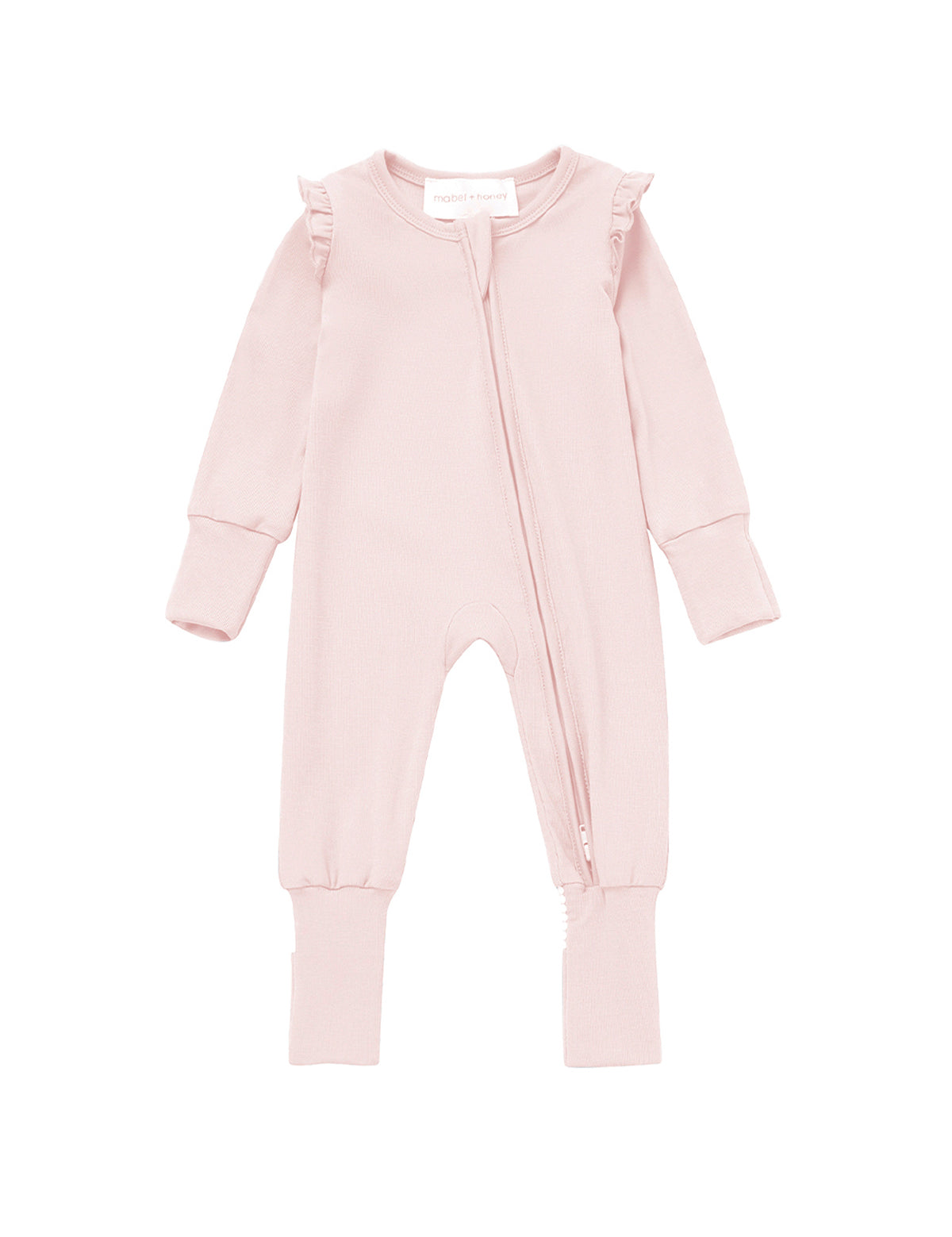 The Amelia Rose Long Sleeve Solid Ruffle Shoulder Convertible Romper by Mabel and Honey is a light pink baby onesie featuring long sleeves, a front zipper, ruffle details on the shoulders, ribbed cuffs, and ankle-length legs. Designed with a comfortable ribbed knit texture, this charming piece of pink baby clothing is displayed laid flat on a white background.