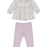 The Soft Meadow Two Piece Set by Mabel and Honey features a long-sleeve floral top with a ruffle-trimmed Peter Pan collar and coordinating purple leggings, all crafted from soft knit fabric and laid flat on a white background.