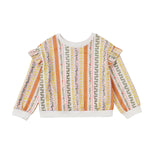 The Mabel and Honey Buttercup Blossom Sweater is a colorful long-sleeve pullover featuring vertical floral and geometric stripes in orange, green, red, and white. This vintage-inspired sweater is designed with charming ruffle details on the shoulders and finished with crisp white cuffs at the sleeves and hem.