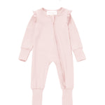 The Mabel + Honey Amelia Rose Convertible Romper features long sleeves, a zipper front, ruffled shoulders, and comes with a matching pink headband adorned with a bow, displayed flat on a white background.