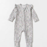 Introducing the Mabel + Honey Whimsical Wildflower Convertible Romper—this long-sleeve floral print romper features ruffled shoulders, a convenient front zipper, and a whimsical wildflower ditsy design in muted tones. The look is charmingly completed with a coordinating fabric headband placed above the romper.