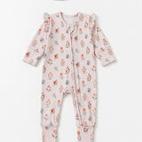 The Amelia Rose Convertible Romper by Mabel + Honey features a charming long sleeve floral print design with ruffled shoulders and comes with a matching headband, shown here laid flat on a white background.