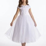 A girl wearing a Lauren Marie Satin Beaded Lace Bodice Dress with a white beaded lace bodice and a flared tulle skirt, holding the hem out to the sides.